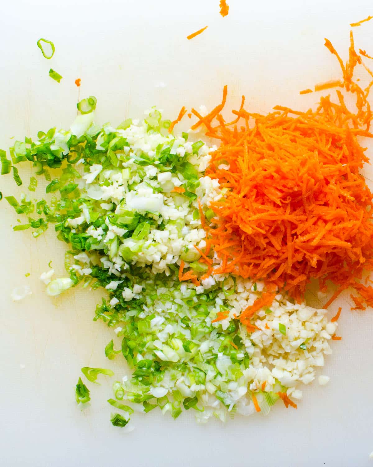 Carrots, garlic and scallions, finely minced.