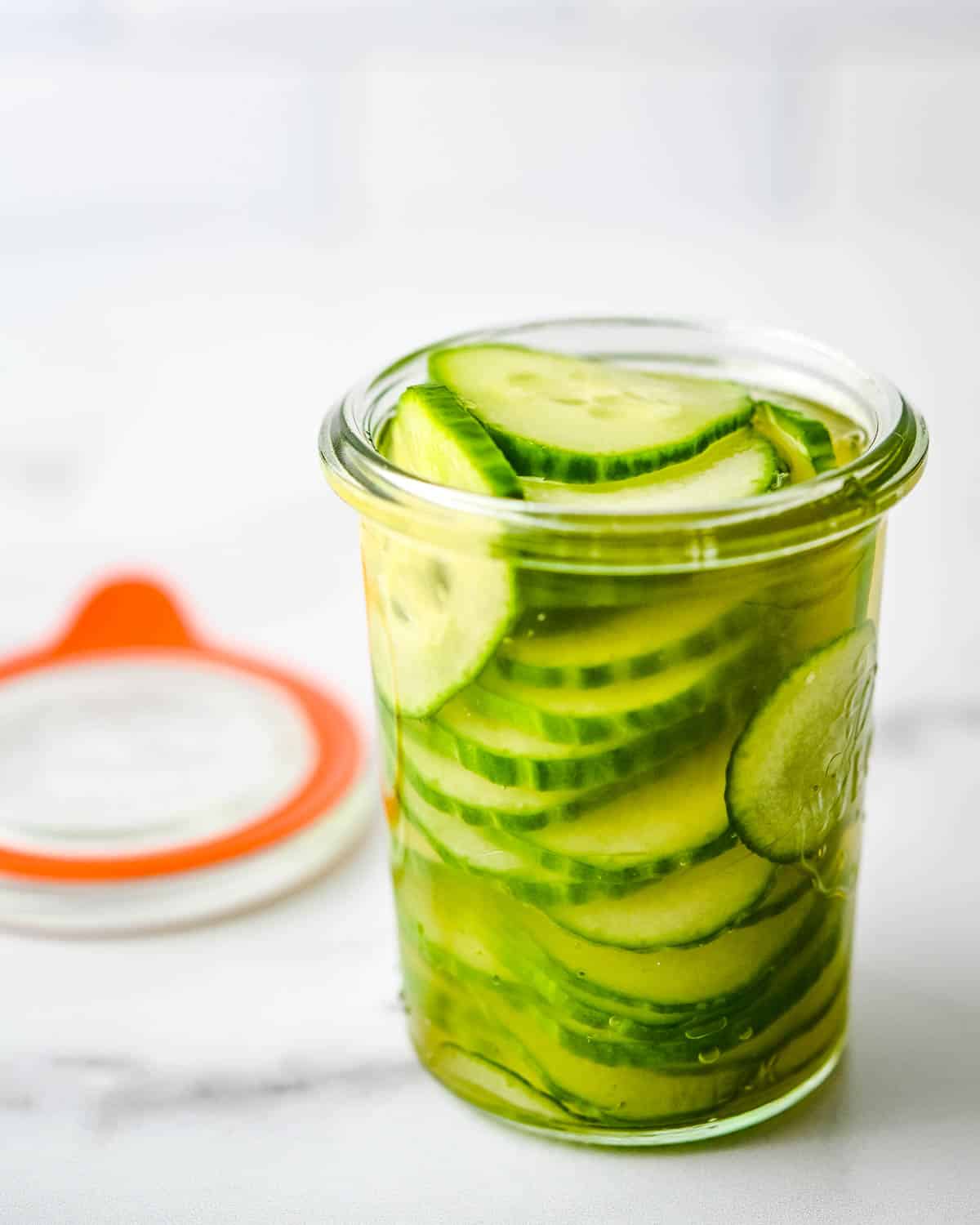 A jar of freshly pickled cucumbers.