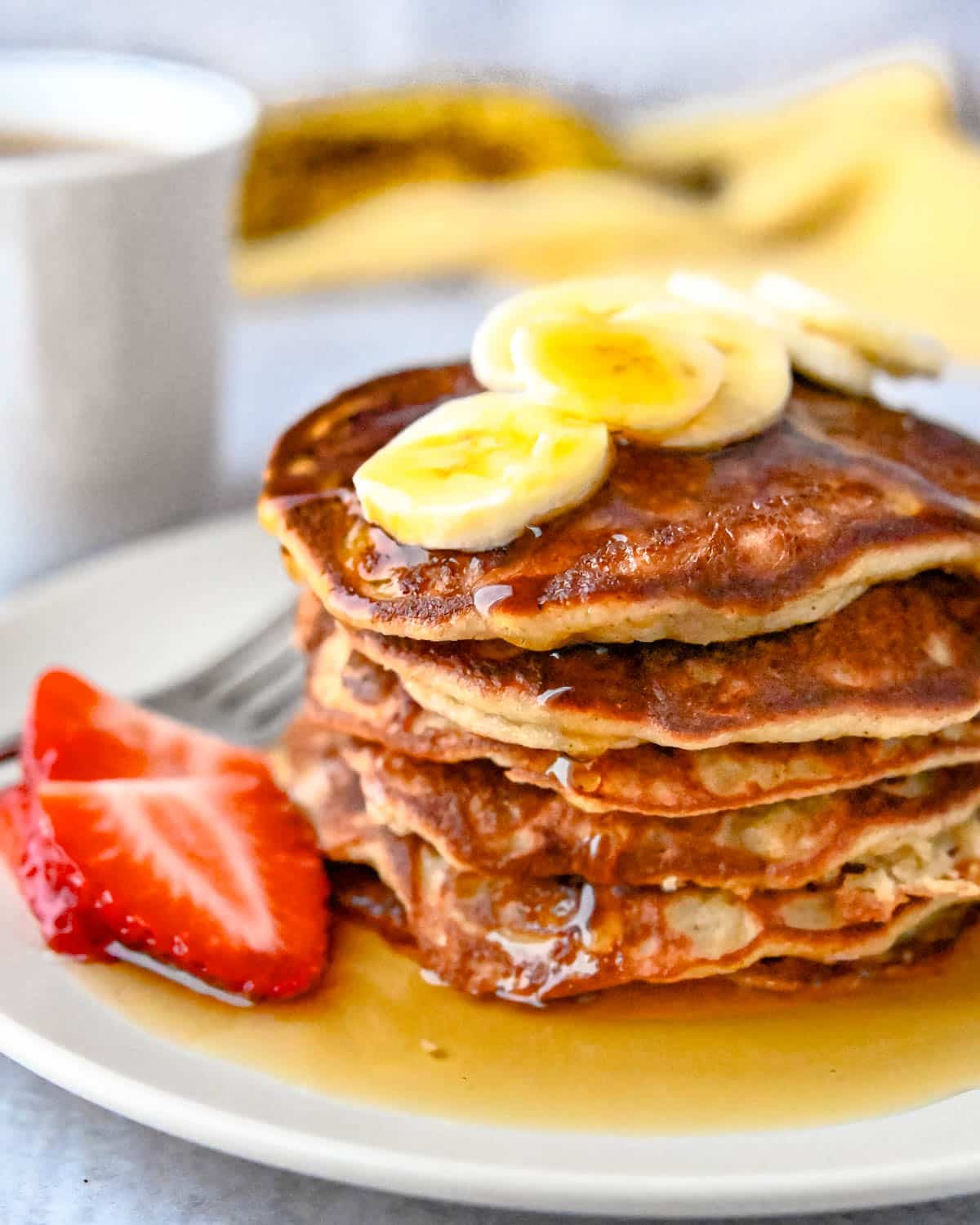 Gluten-free, dairy-free pancakes with maple syrup.
