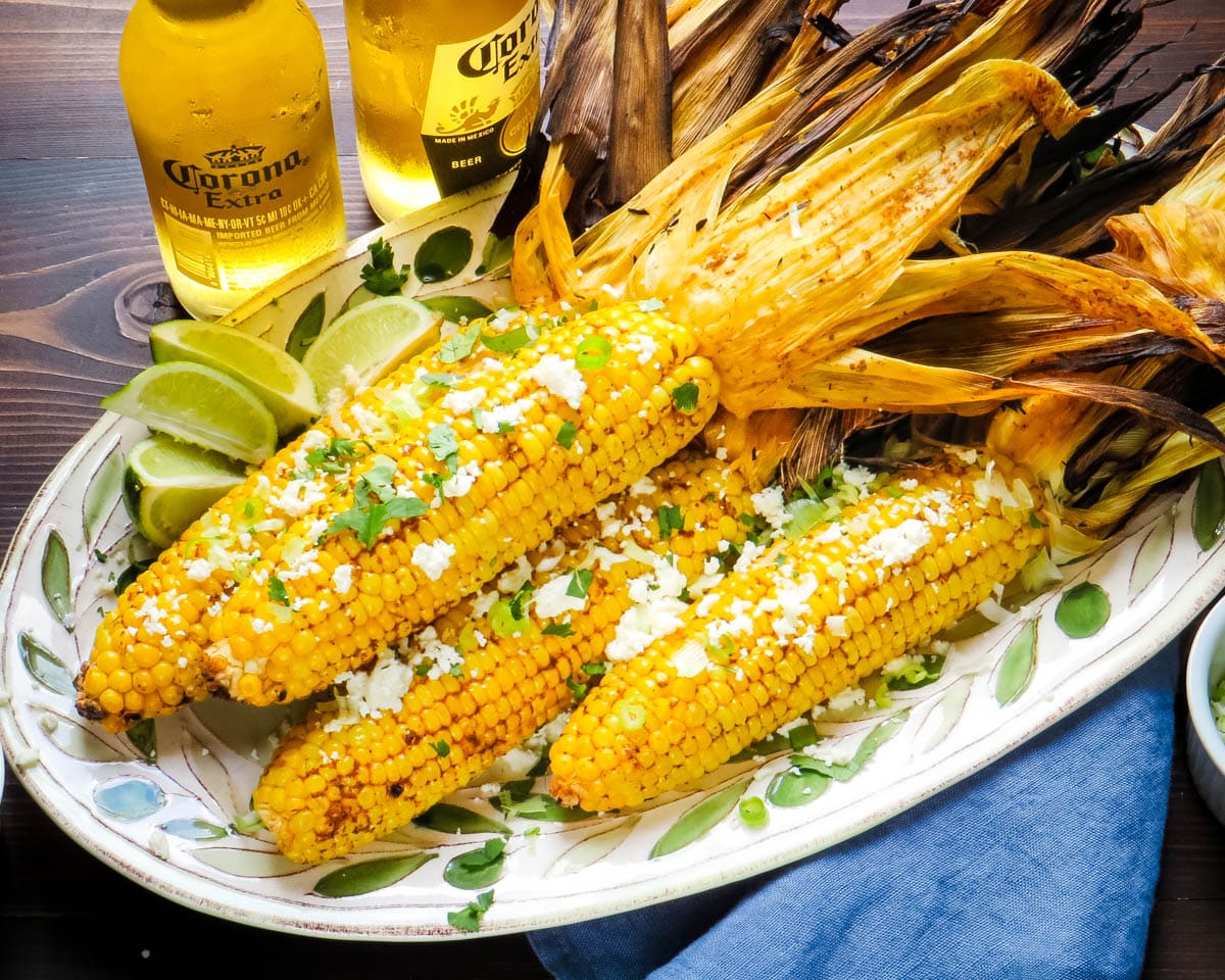 Grilled corn on the cob recipe served with cold beer.