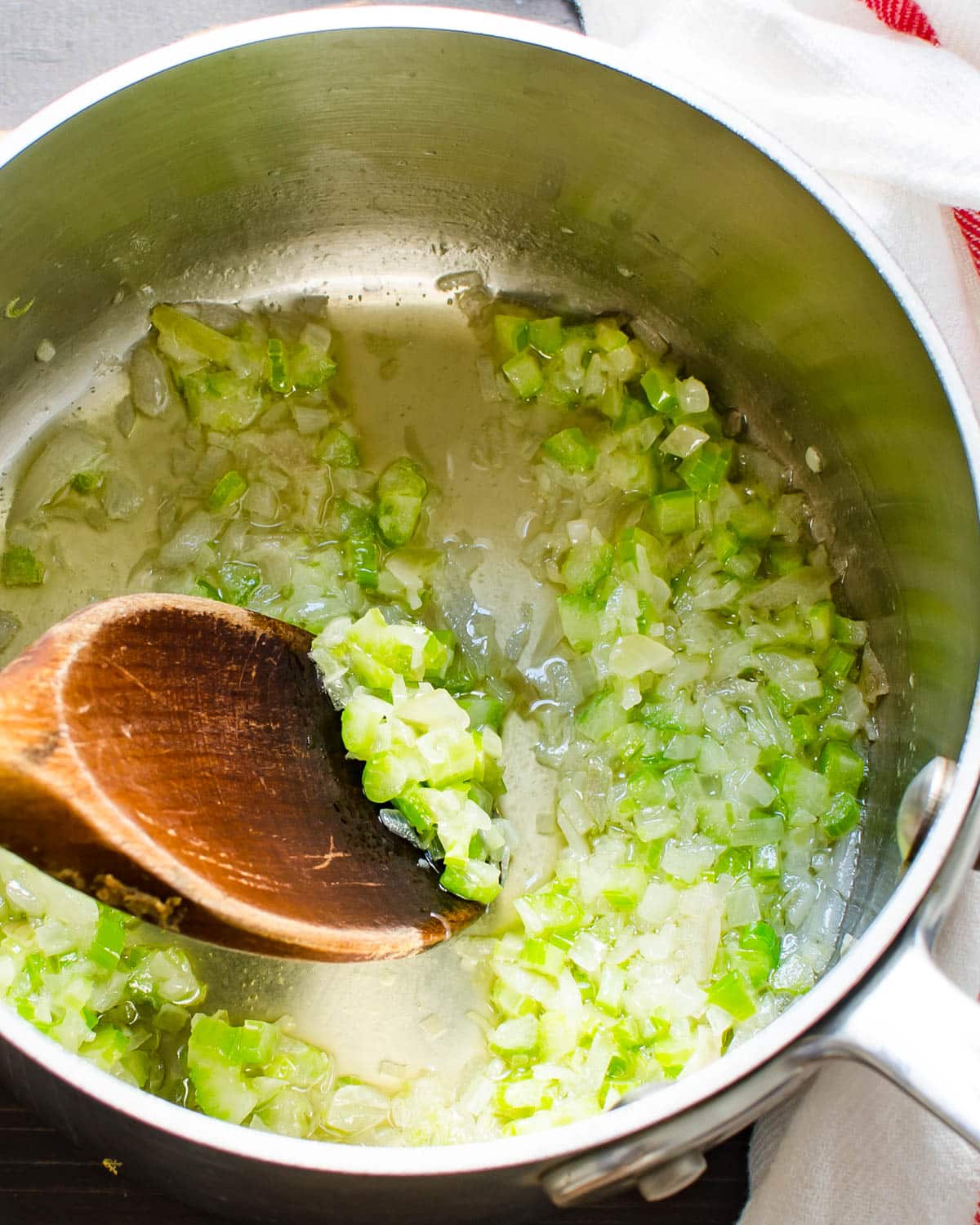 sweating onions and celery in a pot.