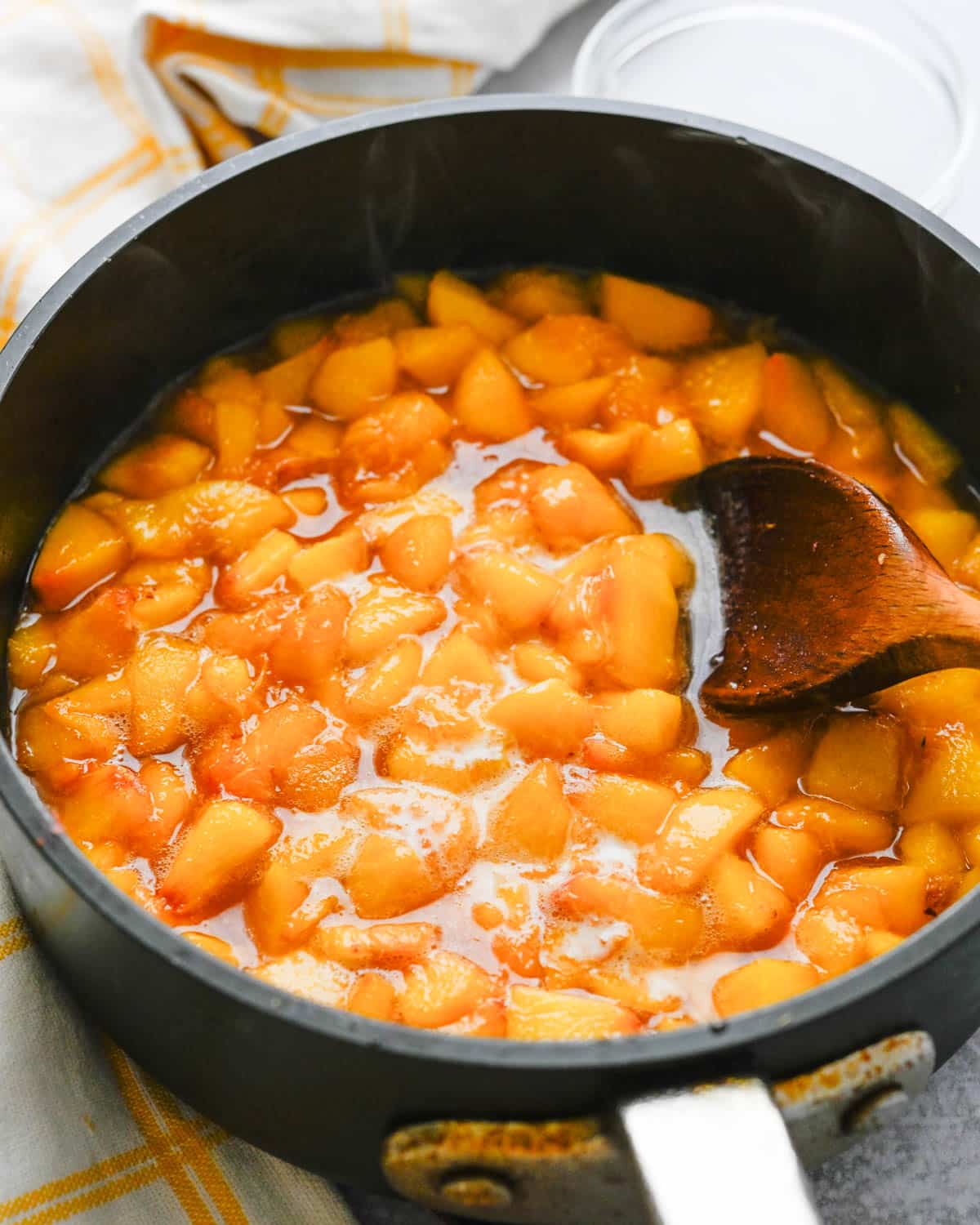 I am cooking chopped peaches in a saucepan with sugar and cornstarch slurry.