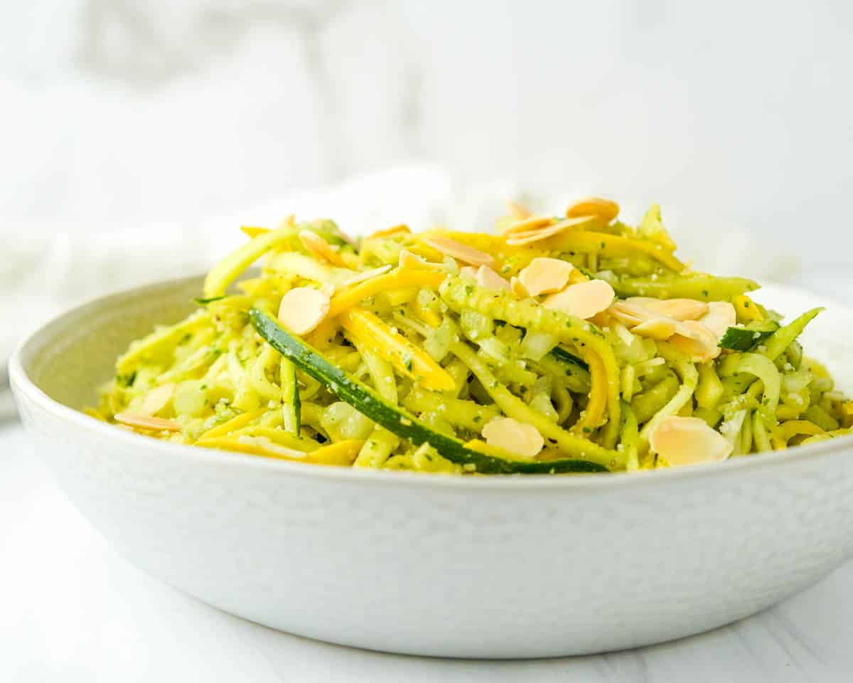 Serving a bowl of fresh summer squash salad.