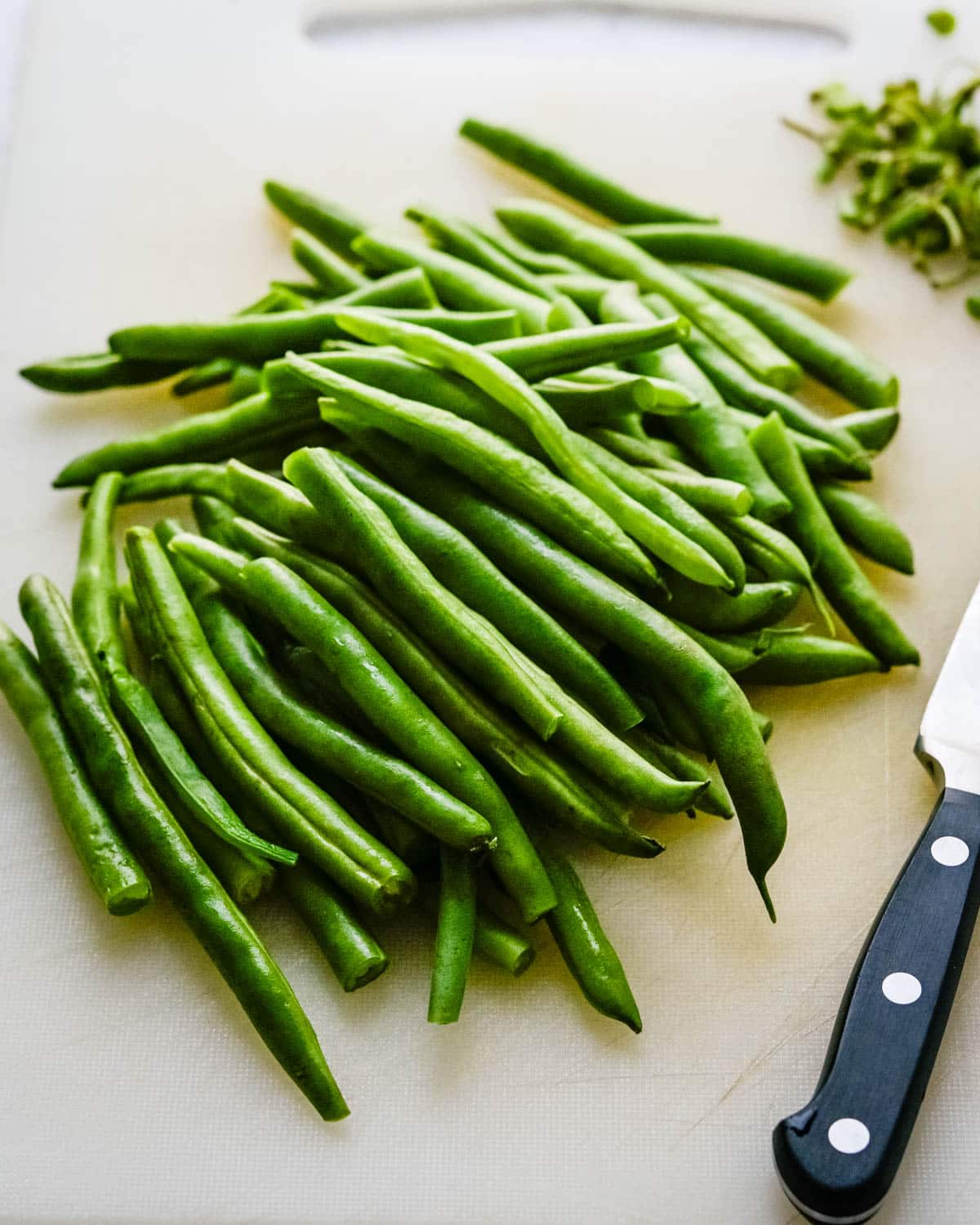 Trim the ends of the French green beans.