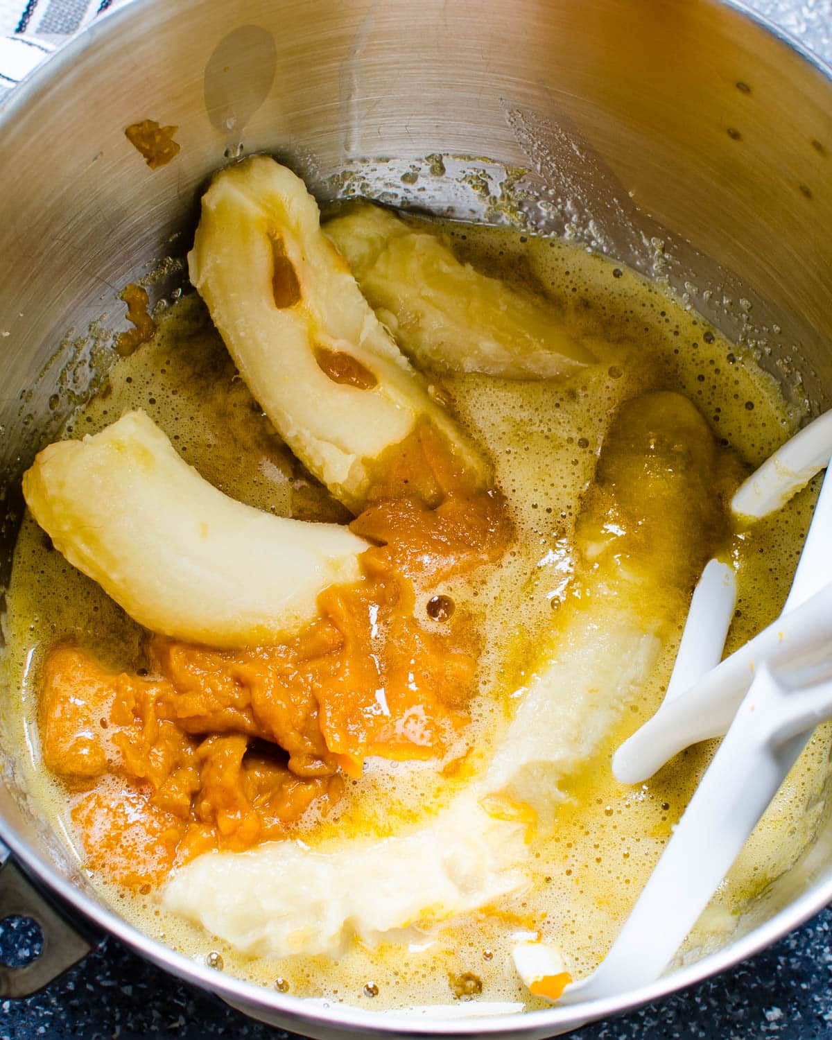 Adding pumpkin puree and ripe bananas.