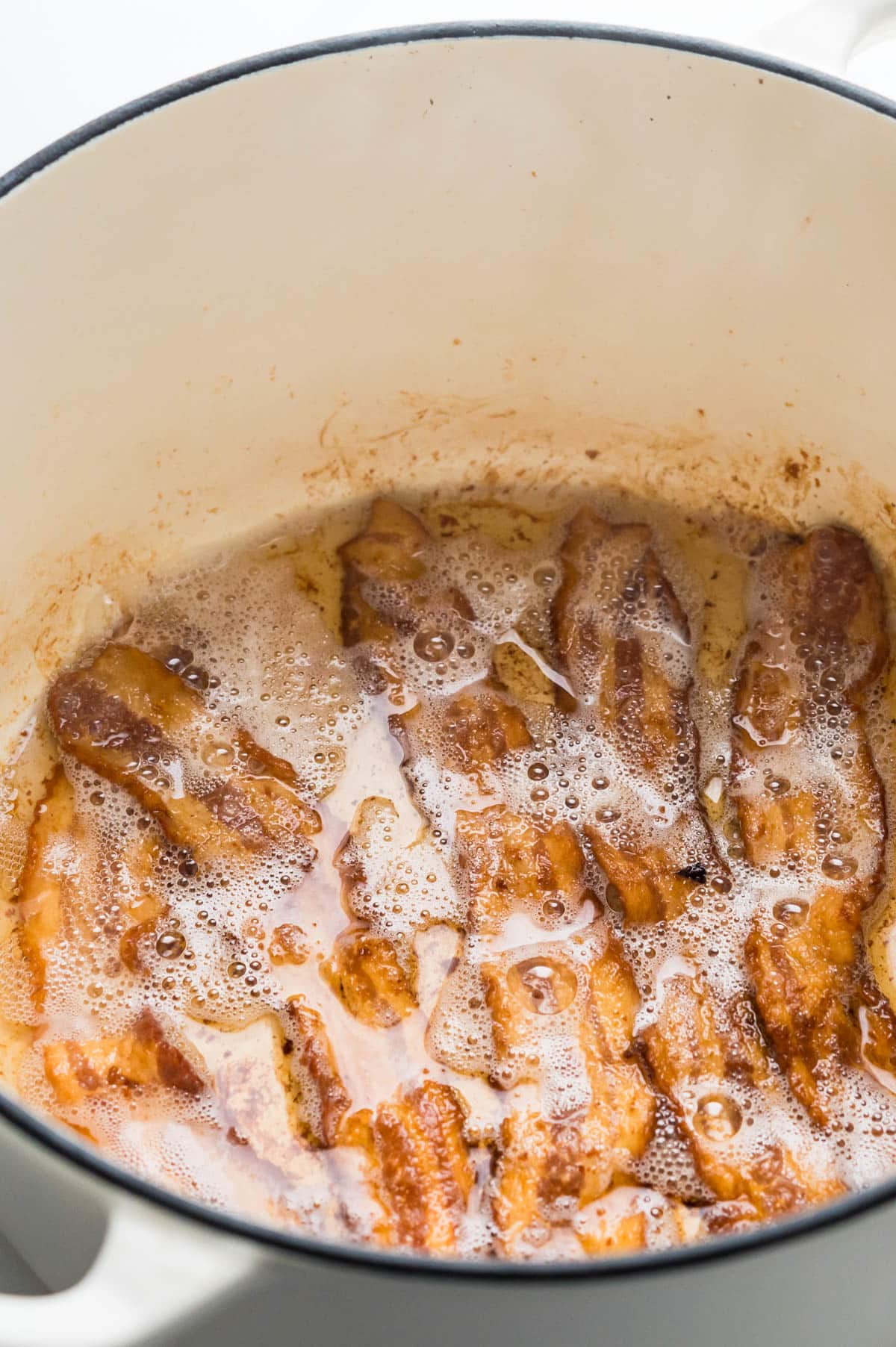 crisping bacon in a dutch oven to render the fat.