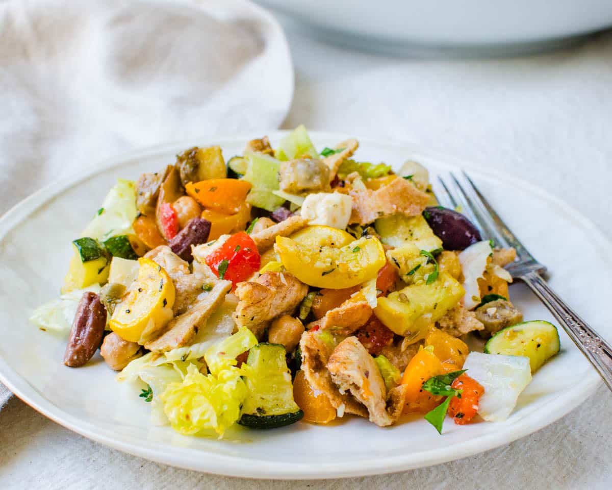 A serving of fattoush on a white plate. 