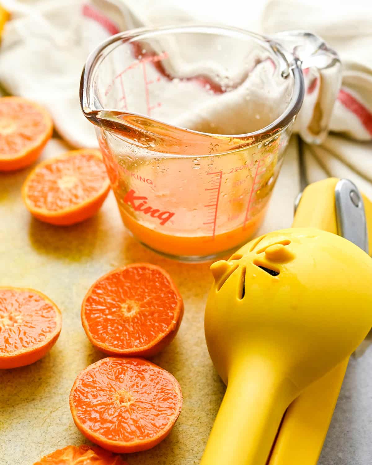 Squeezing mandarins for their juice.