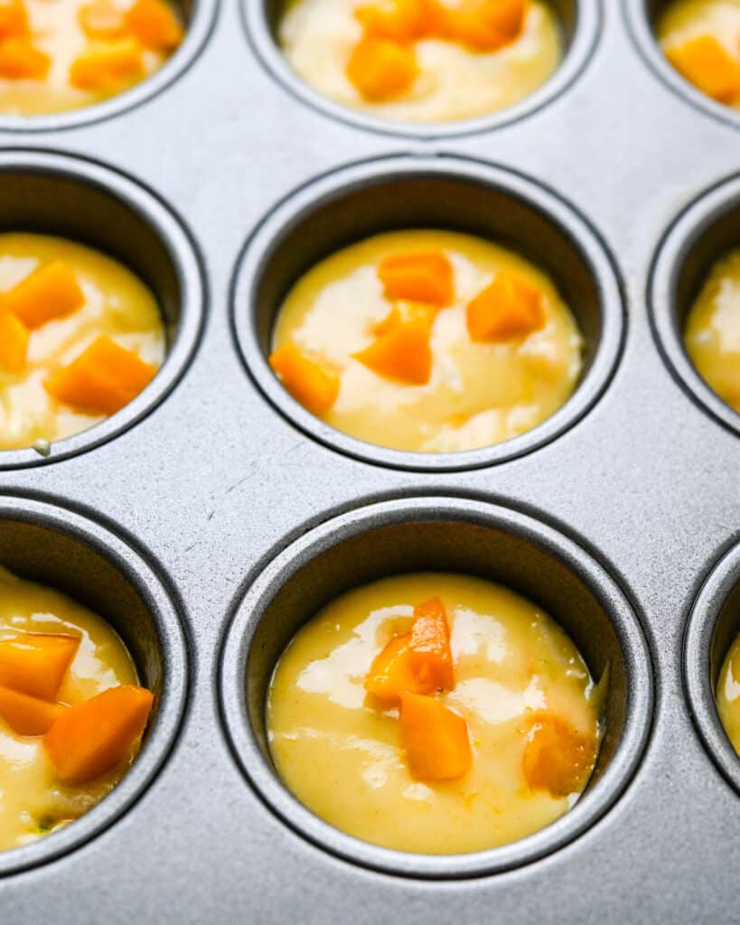 Baking mango mini muffins.