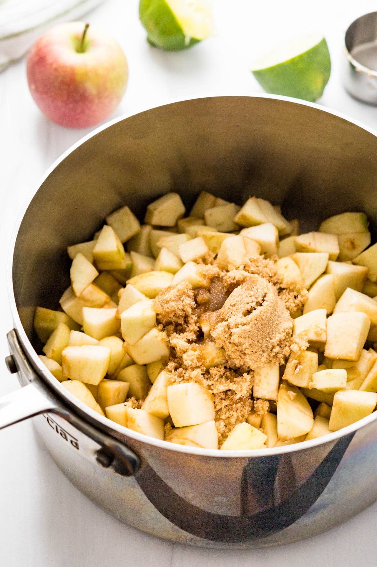 Combining apples with brown sugar and lime juice.