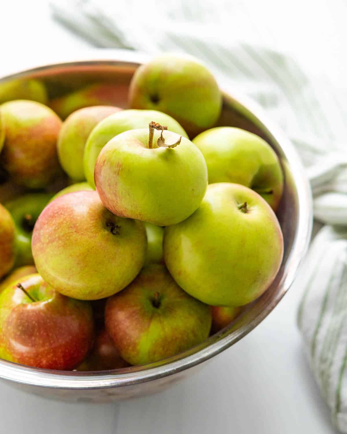 A large bowl of McIntosh apples.