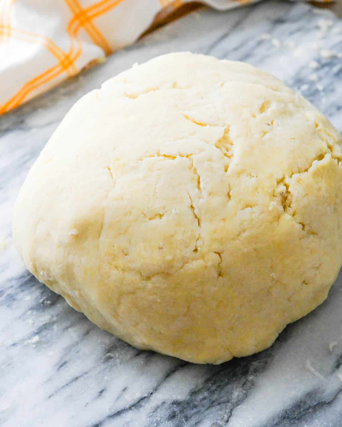 Forming the potato mixture into a ball of dough