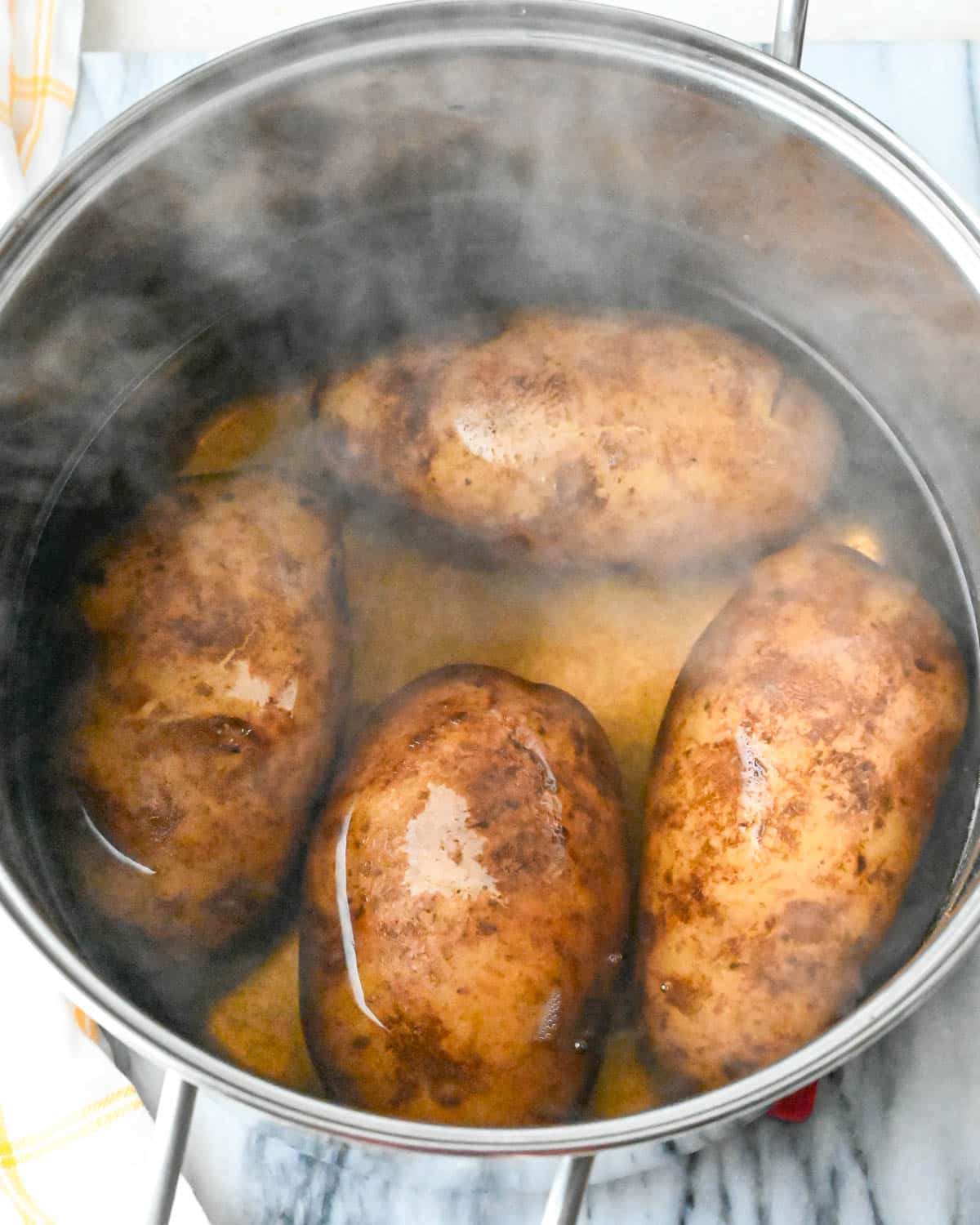 I am boiling russet potatoes until tender.
