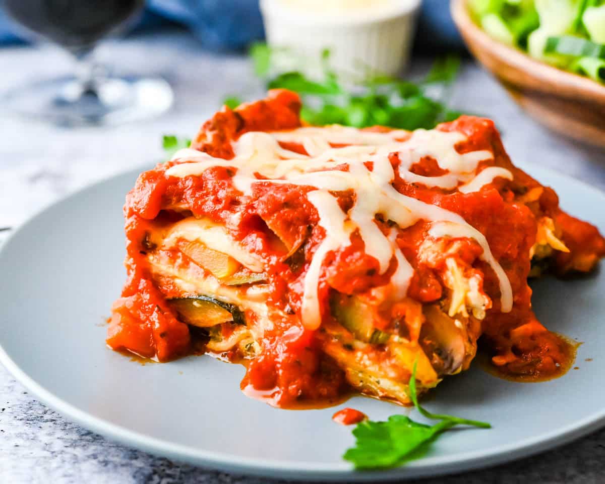 A slice of the cottage cheese lasagna recipe on a plate to show the layers of vegetables.