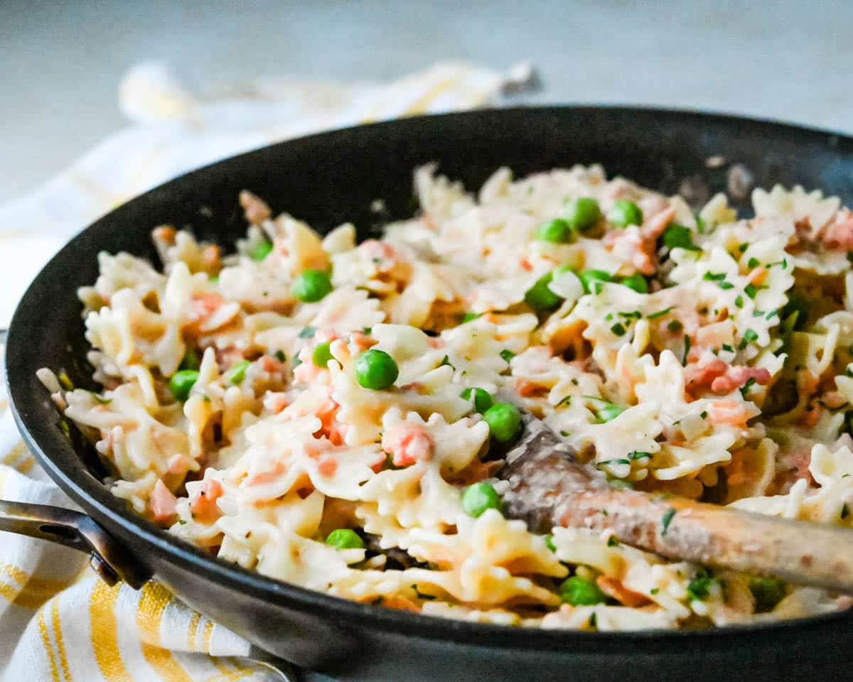 The smoked salmon pasta in a skillet.