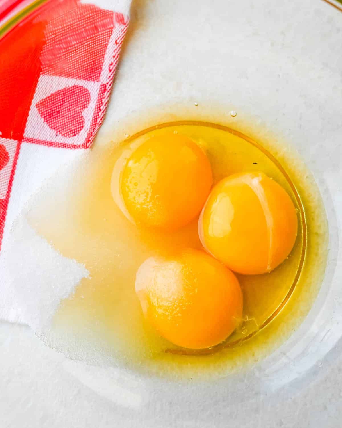 Combining eggs and sugar. 