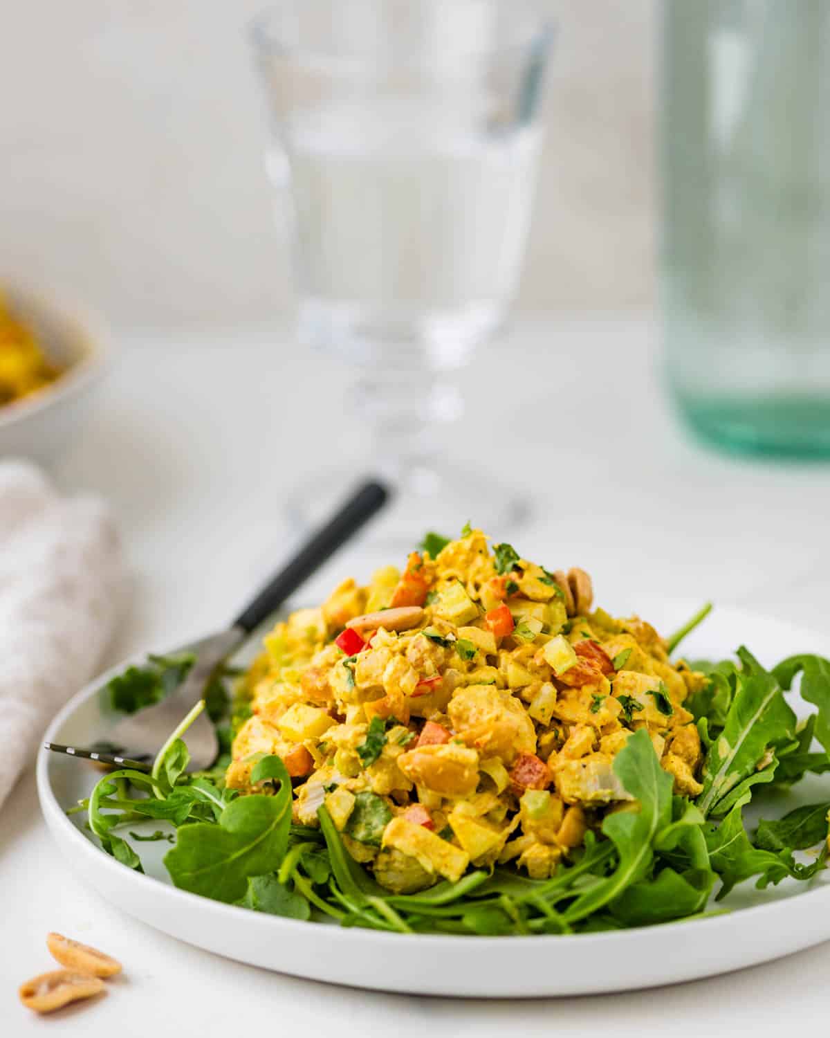 Curried chicken salad on a bed of greens.
