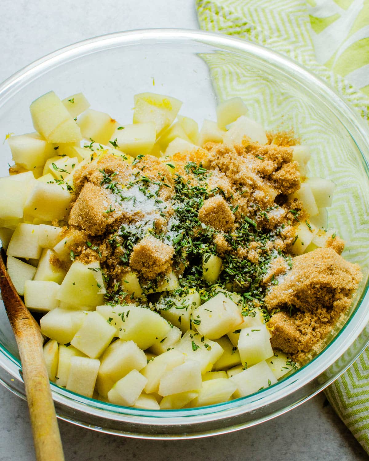 I am combining diced pears with fresh herbs and brown sugar.