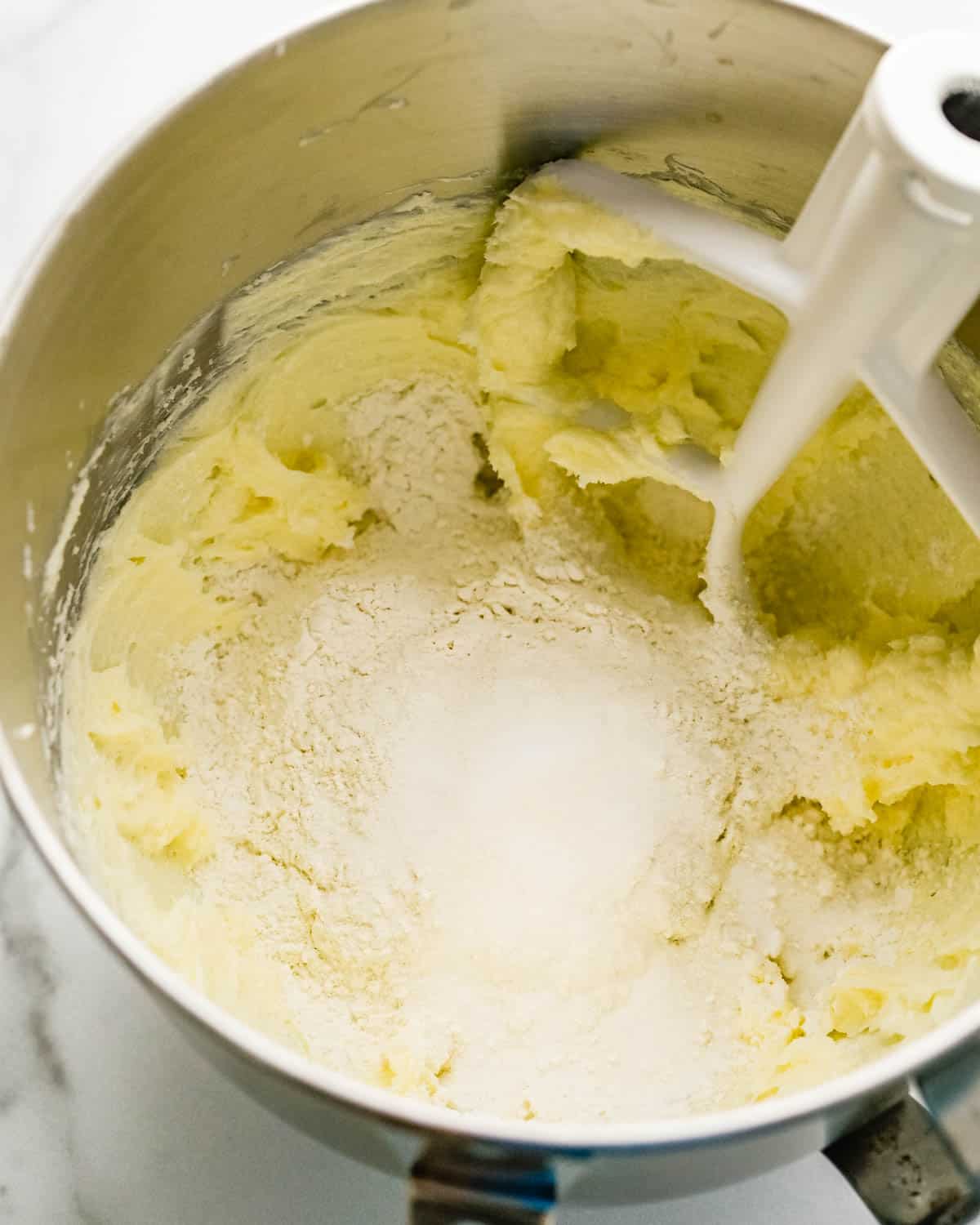 Making the sugar cookie dough in a stand mixer.