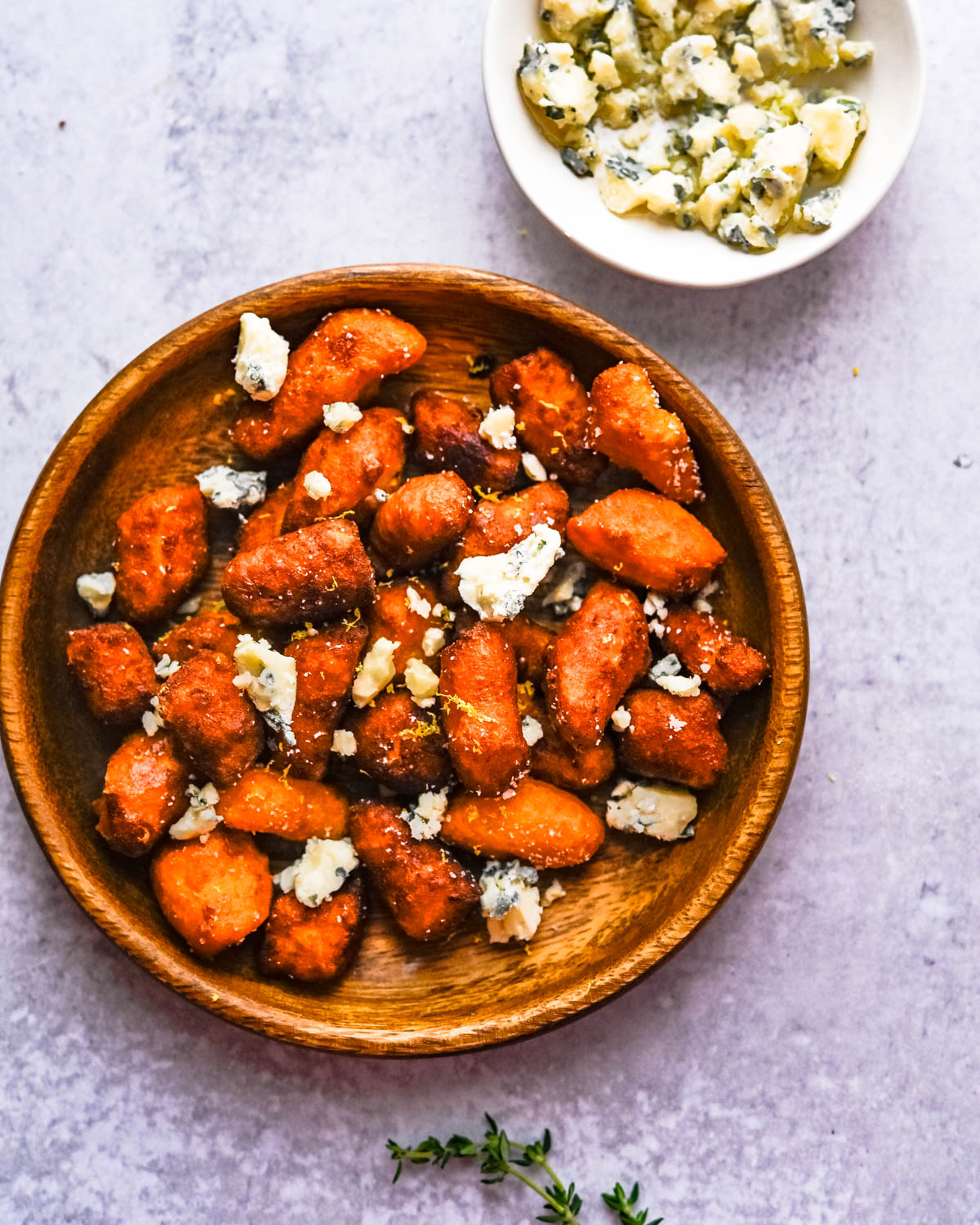 fried sweet potato gnocchi with lemon zest and blue cheese crumbles.