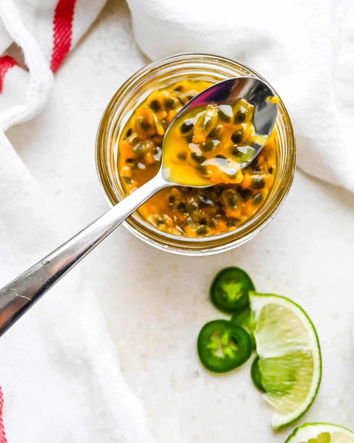 Passion fruit pulp in a glass jar.