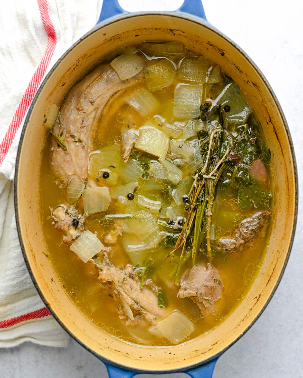 Simmered turkey bones and vegetables in a dutch oven