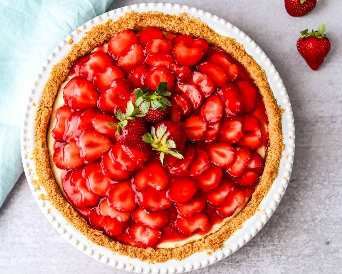A whole Strawberry Ricotta pie with graham cracker crust.