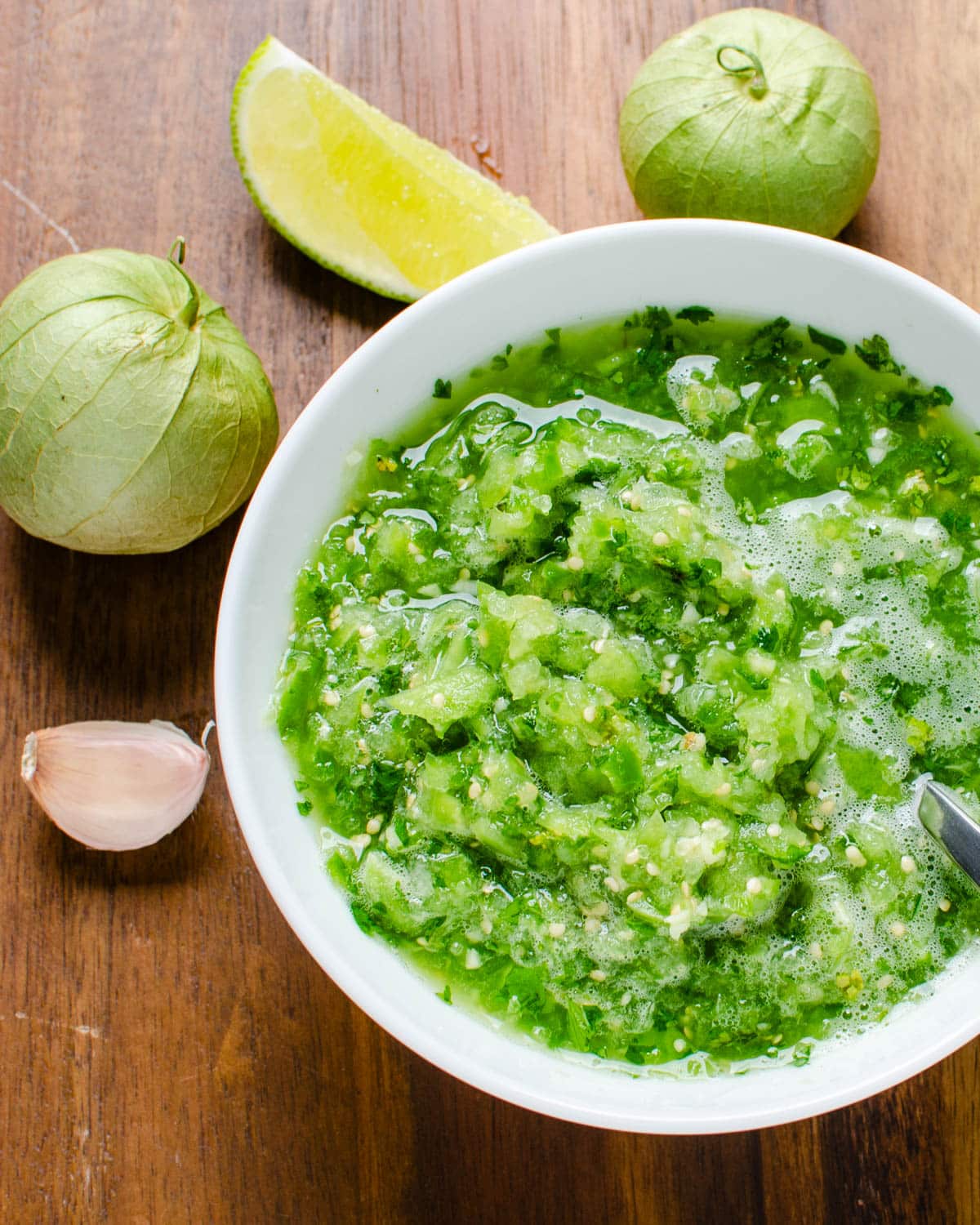 A bowl of fresh tomatillo salsa.