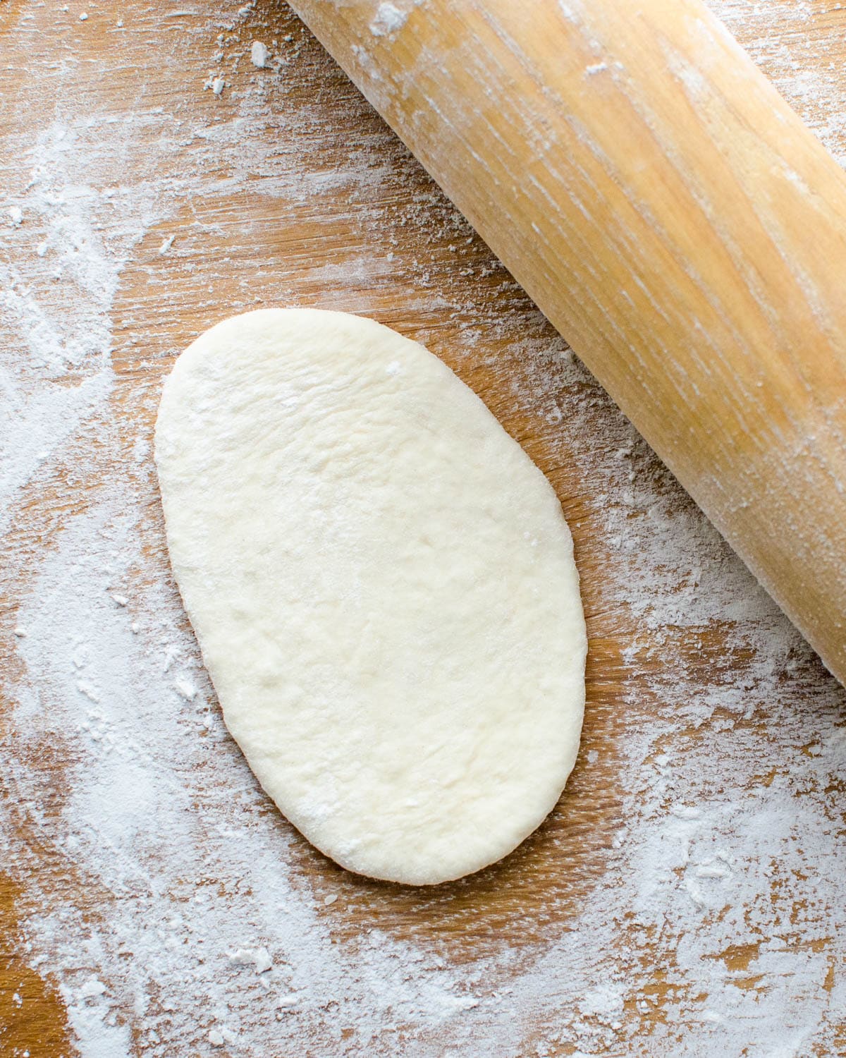 Roll the dough into ovals.