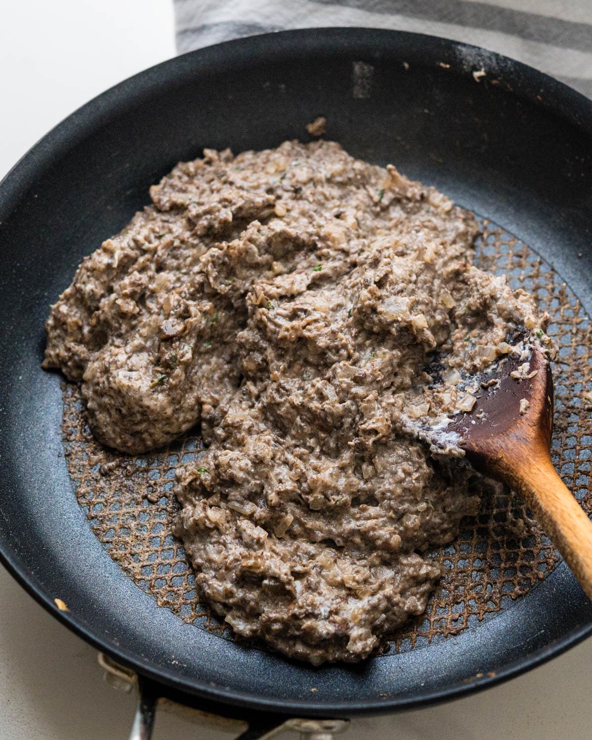 The duxelles is creamy and pasty looking.
