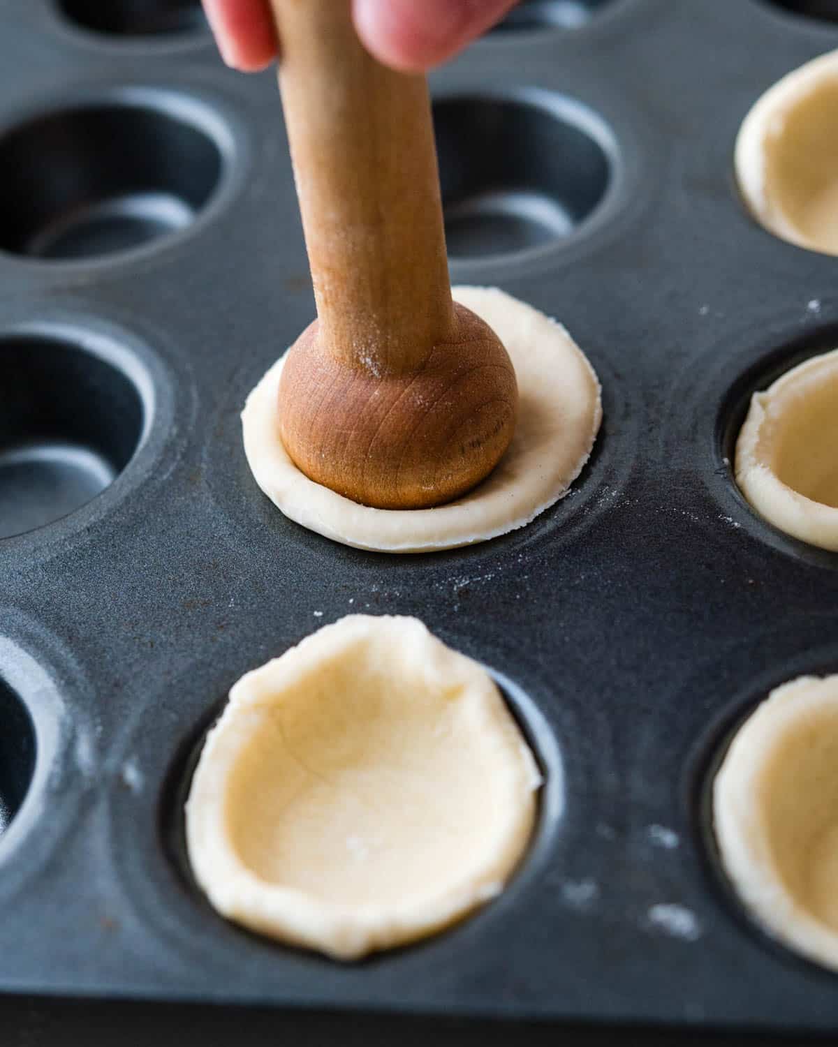 Using a tart tamper to form the shell for the mushroom appetizers.