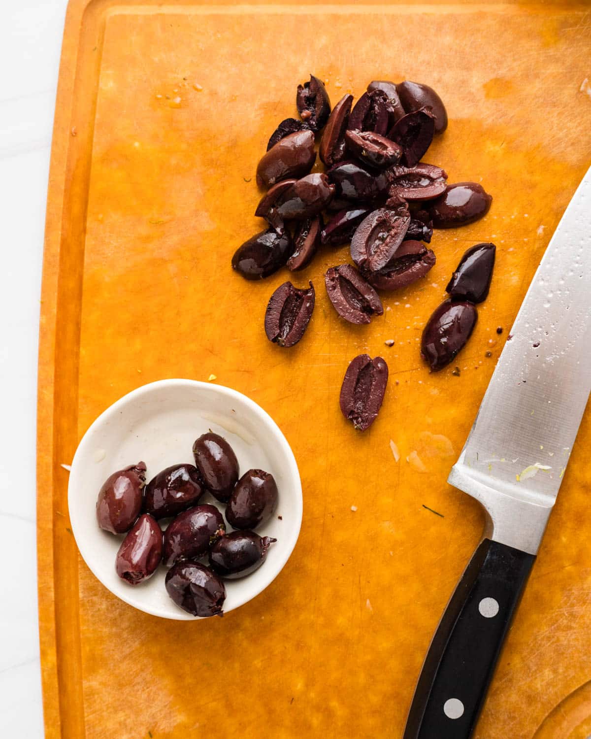 Pitting and slicing kalamata olives.