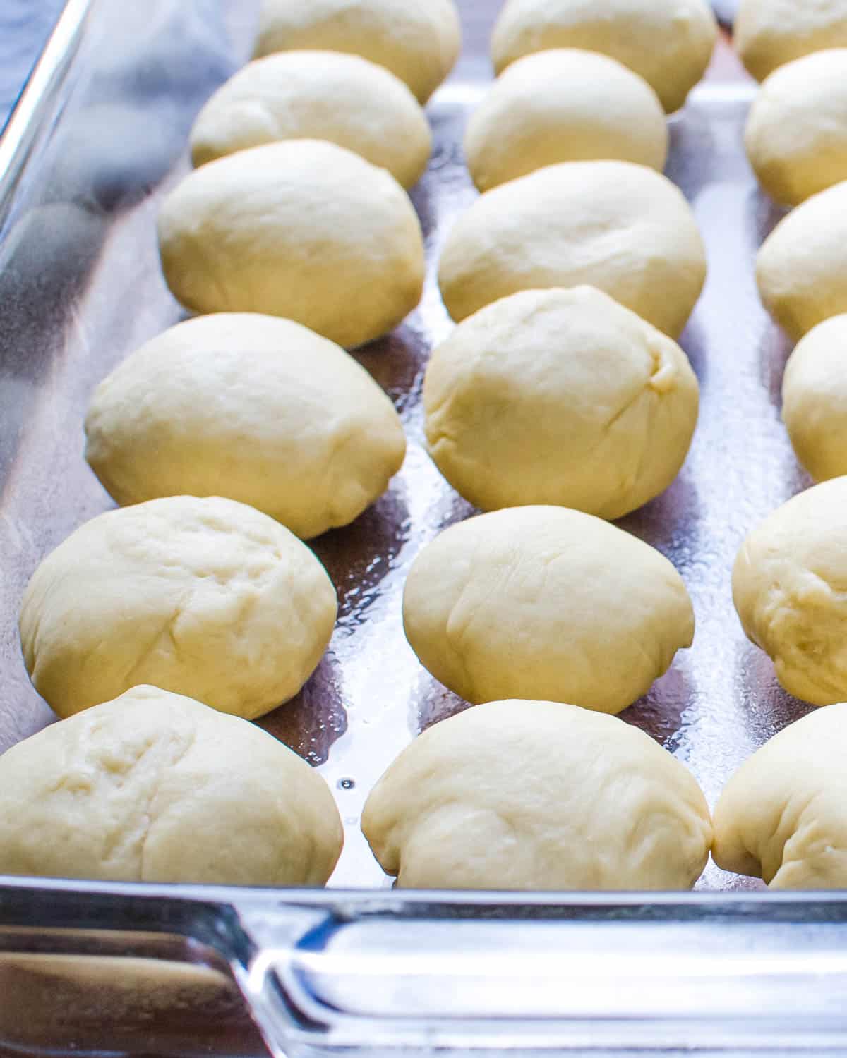 Portioning dough into individual rolls.
