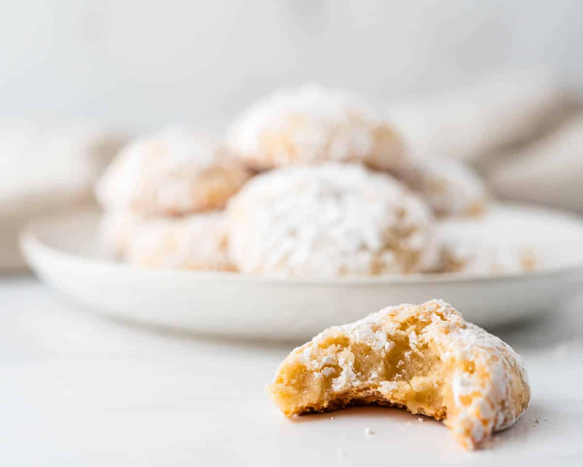 Taking a bite of the chewy Italian almond cookie.