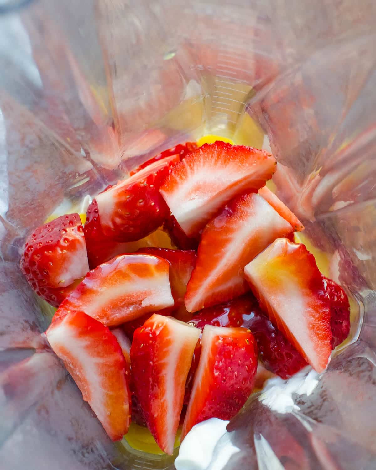 strawberries and honey in a blender. 