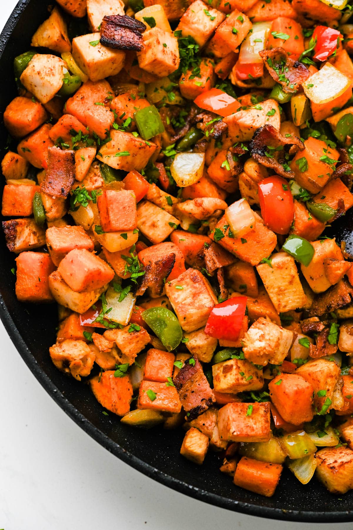 I am combining the sweet potatoes and vegetables with the turkey mixture. 