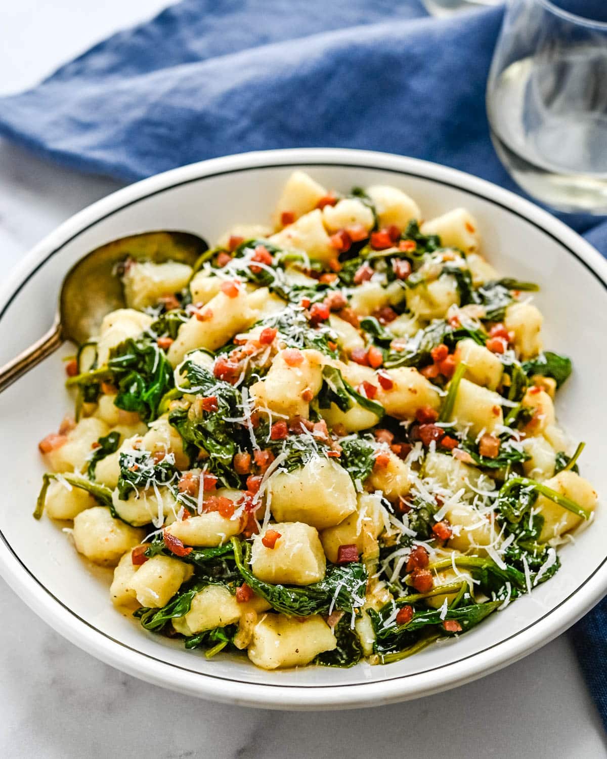 A serving of Italian gnocchi in a shallow bowl.