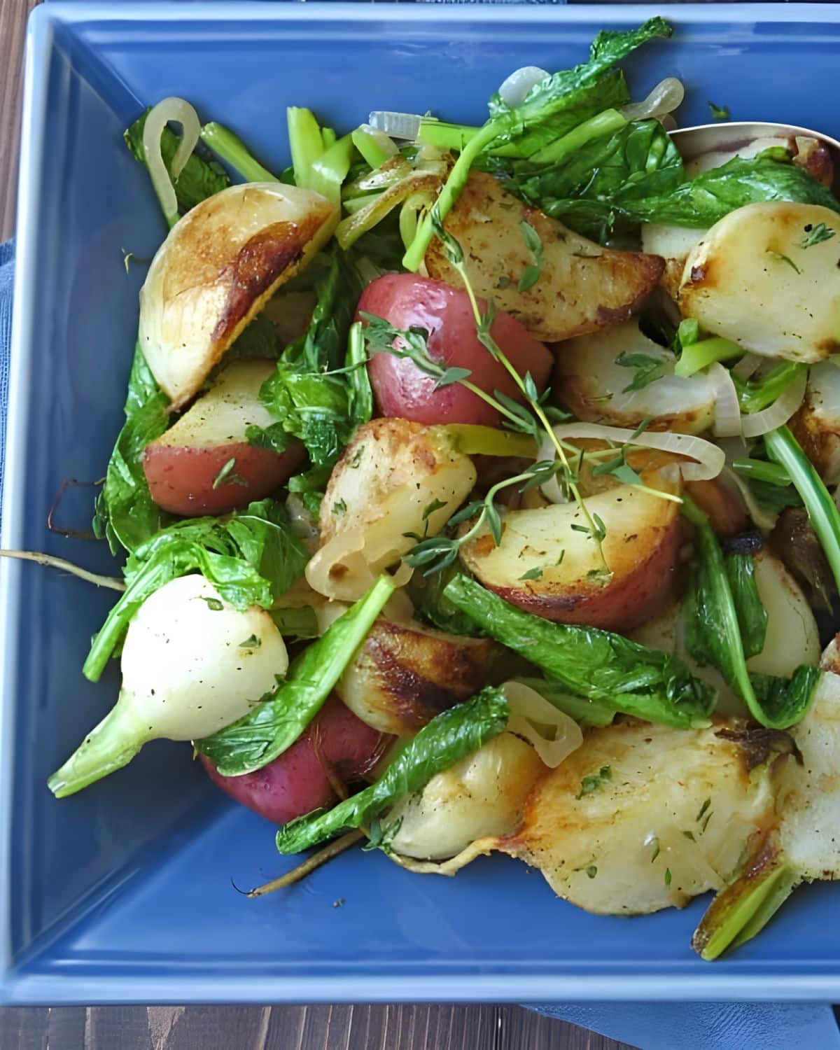 Serving the turnips and potatoes in a blue bowl.