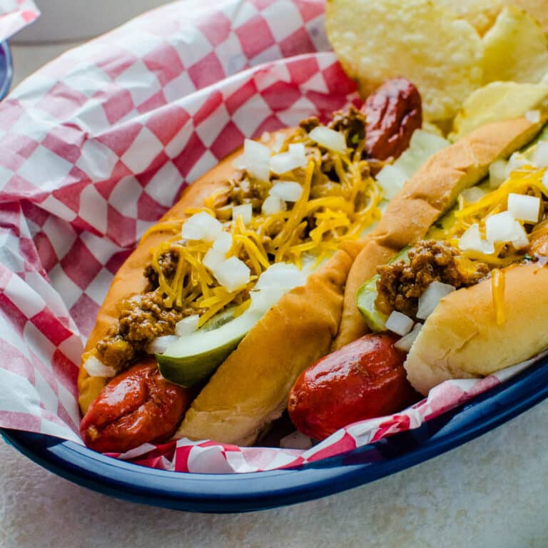 Two chili dogs in a basket.