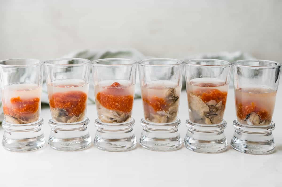Oyster shooters in a row.