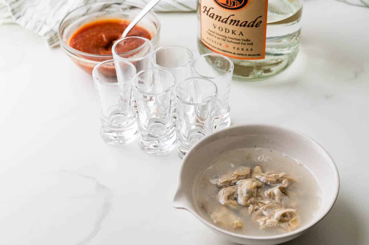 Assembling the ingredients and shot glasses.