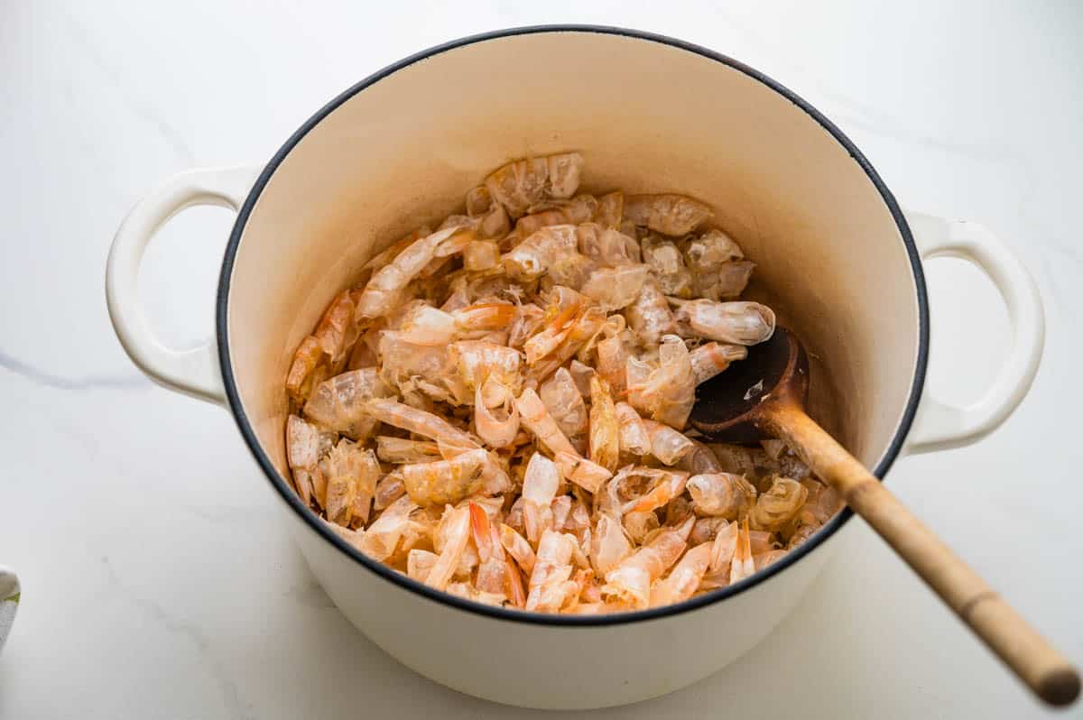 Browning shrimp shells in a Dutch oven.