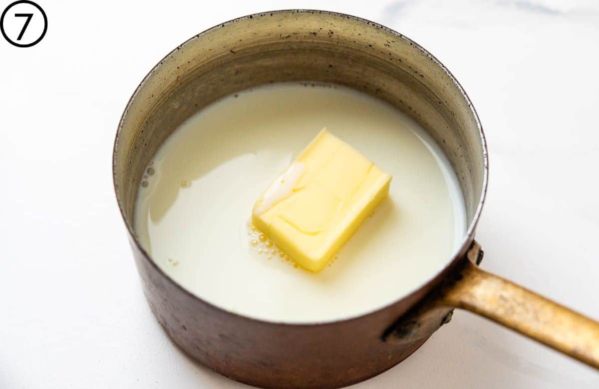 Melting butter in warm milk.
