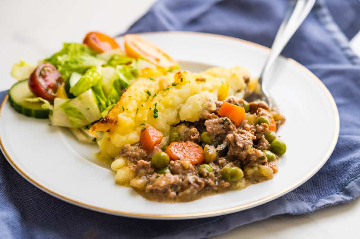 lamb shepherd's pie served with a green salad.
