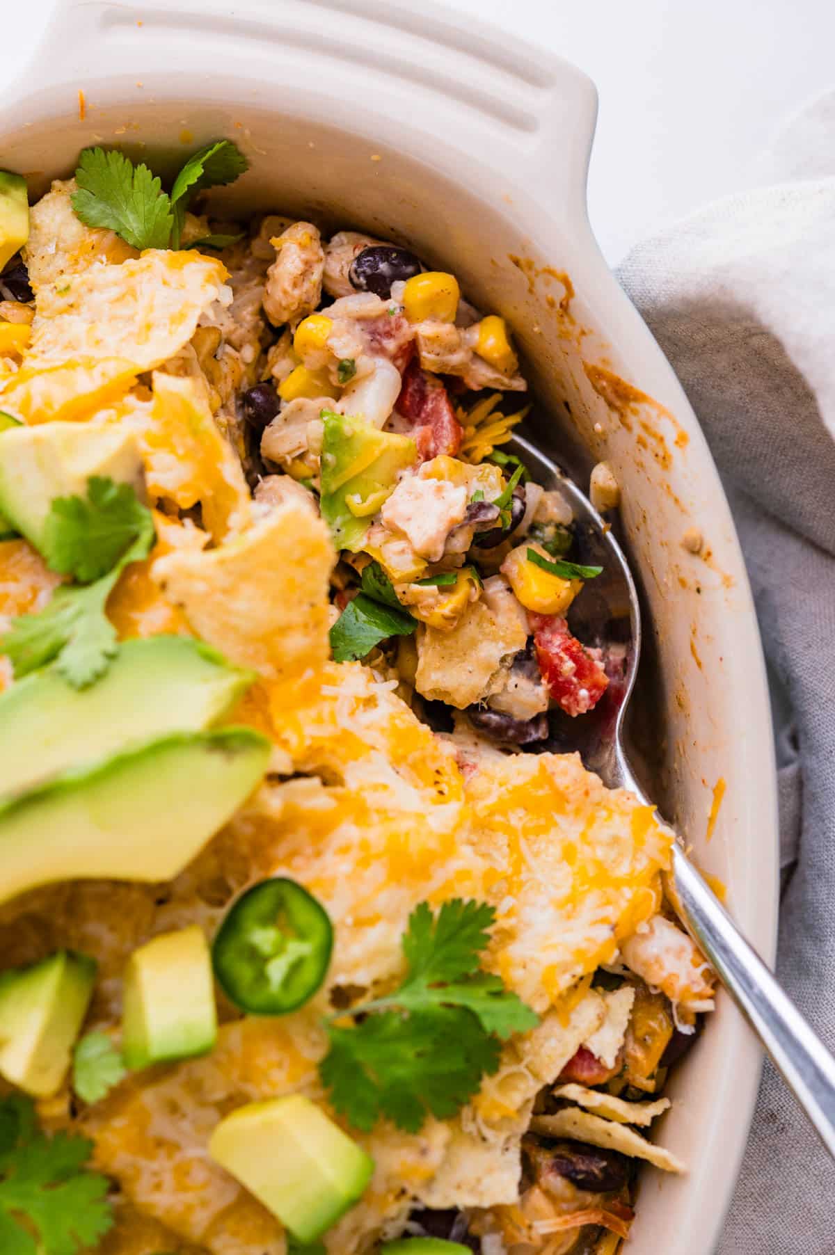 Mexican chicken casserole with cheese and crunchy tortilla chips.