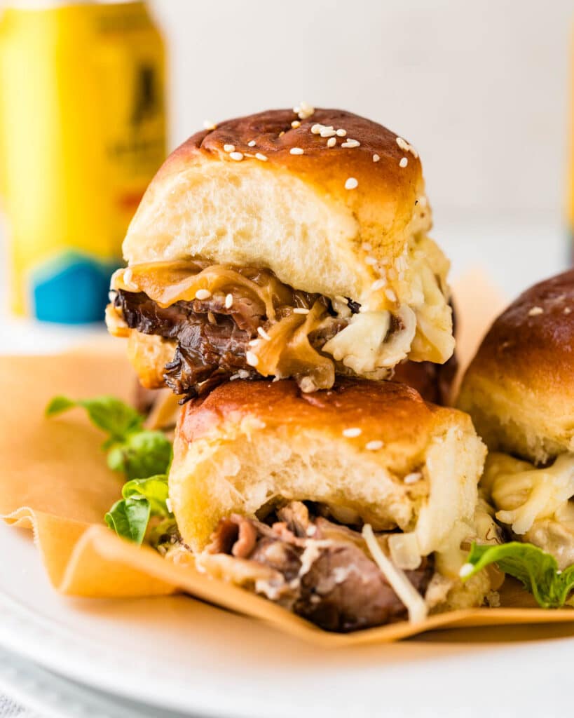 A stack of steak and cheese sliders.