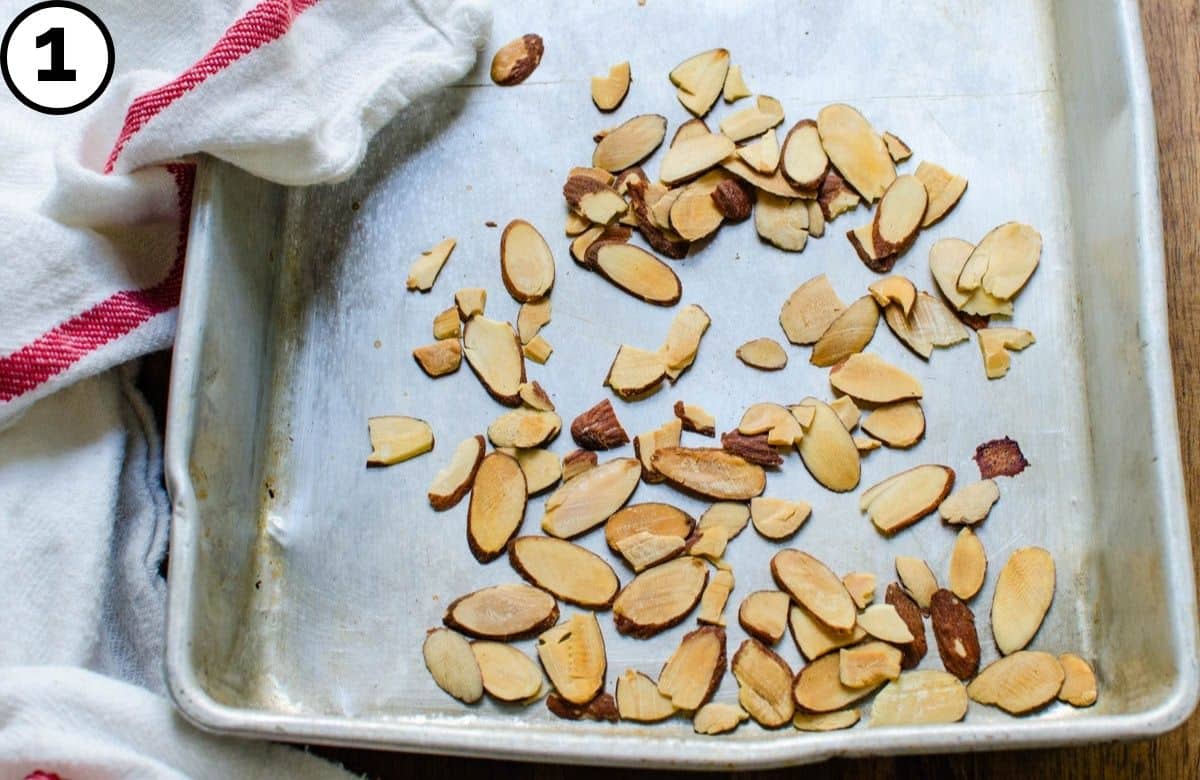 Toasting almonds on a baking sheet.