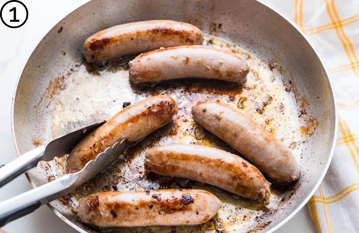 Browning bangers in a hot skillet.