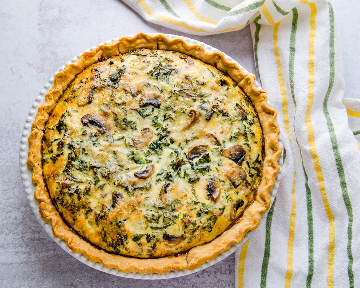 A whole baked kale mushroon quiche.