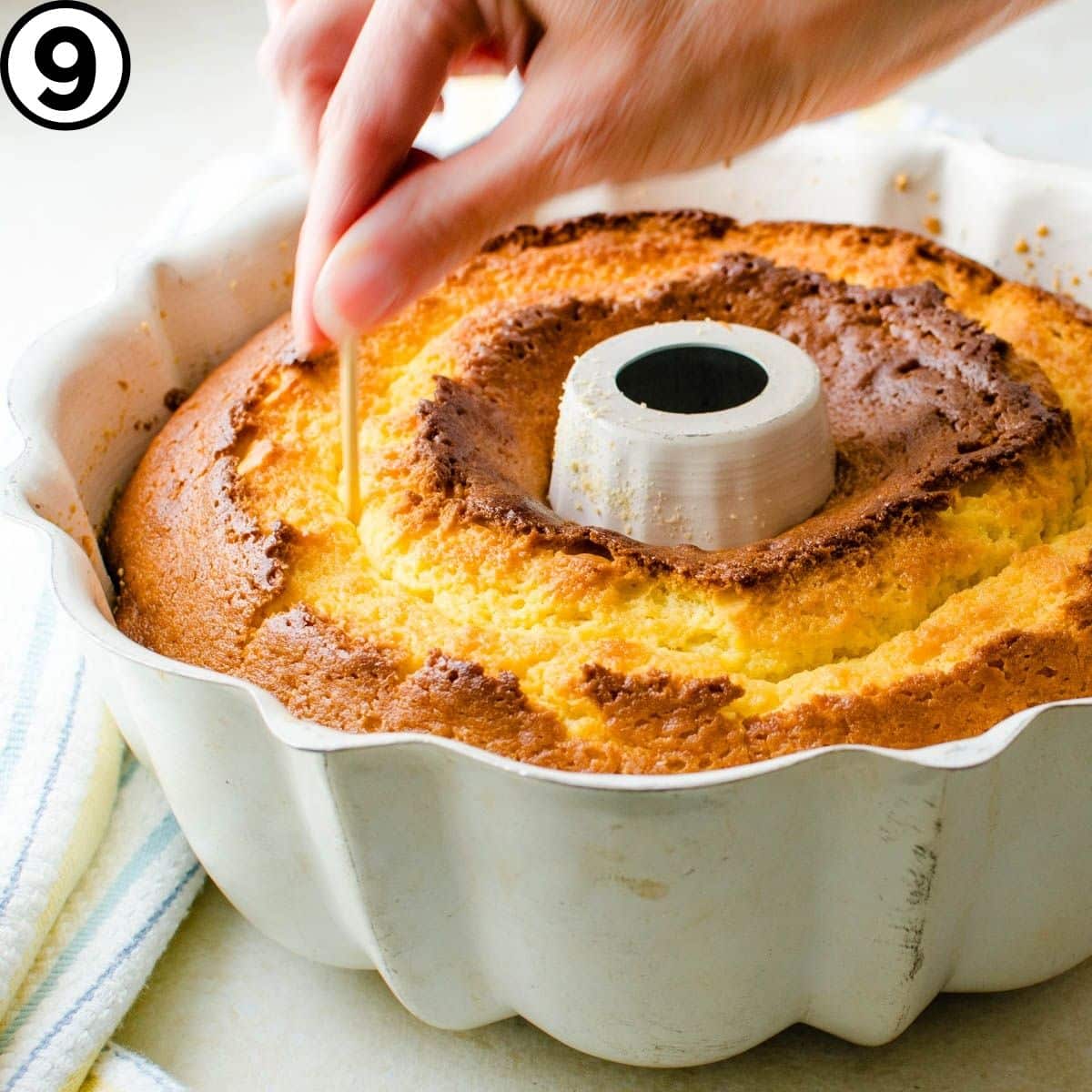 Poking holes in the baked cake. 